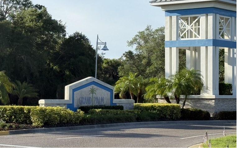 Grand Palm entrance sign and tower, a Neal Communities community in Venice, Florida